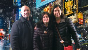 man and two women with NYC background